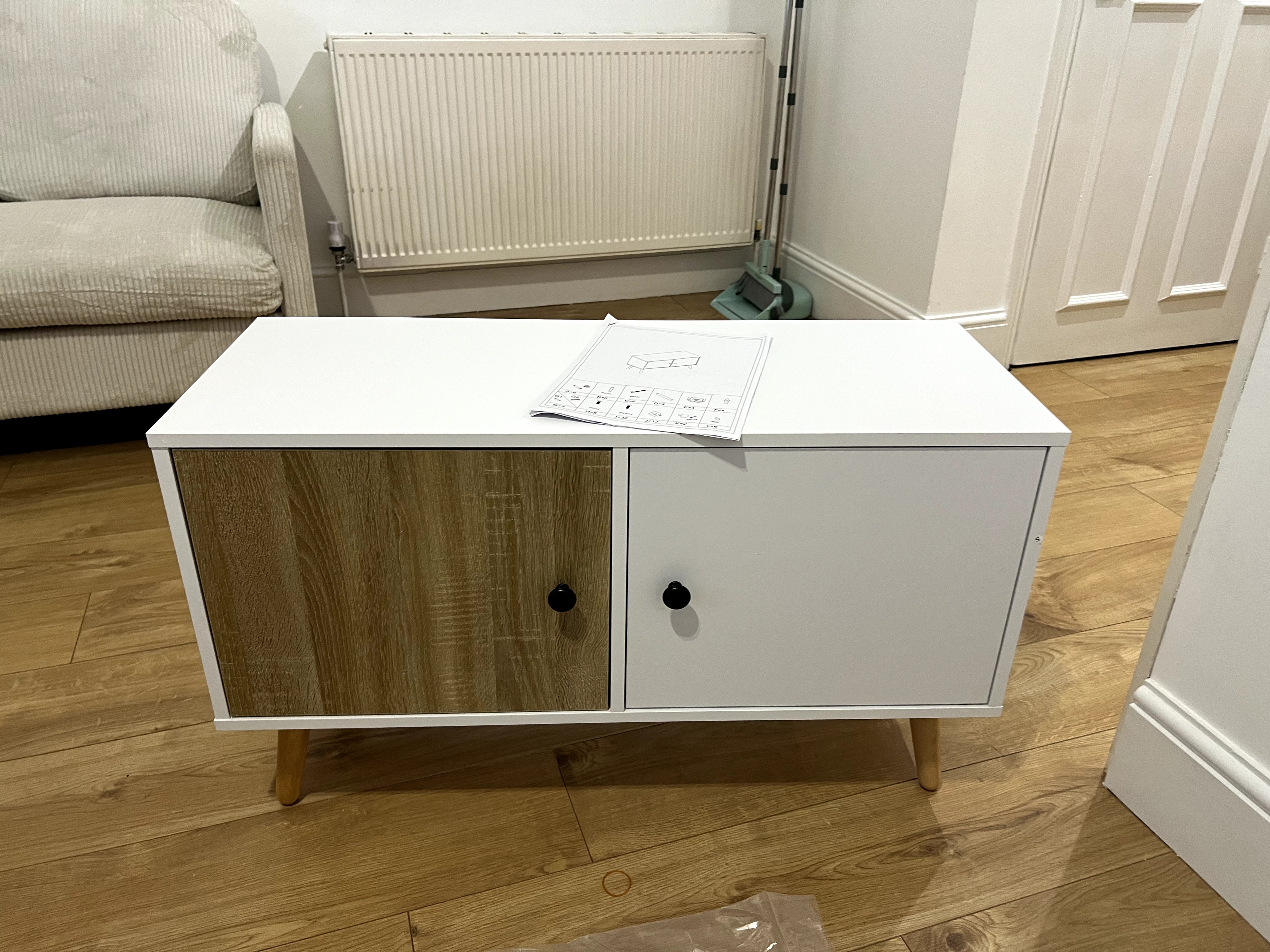 Mid-century style two-tone cabinet with wood and white finish assembled