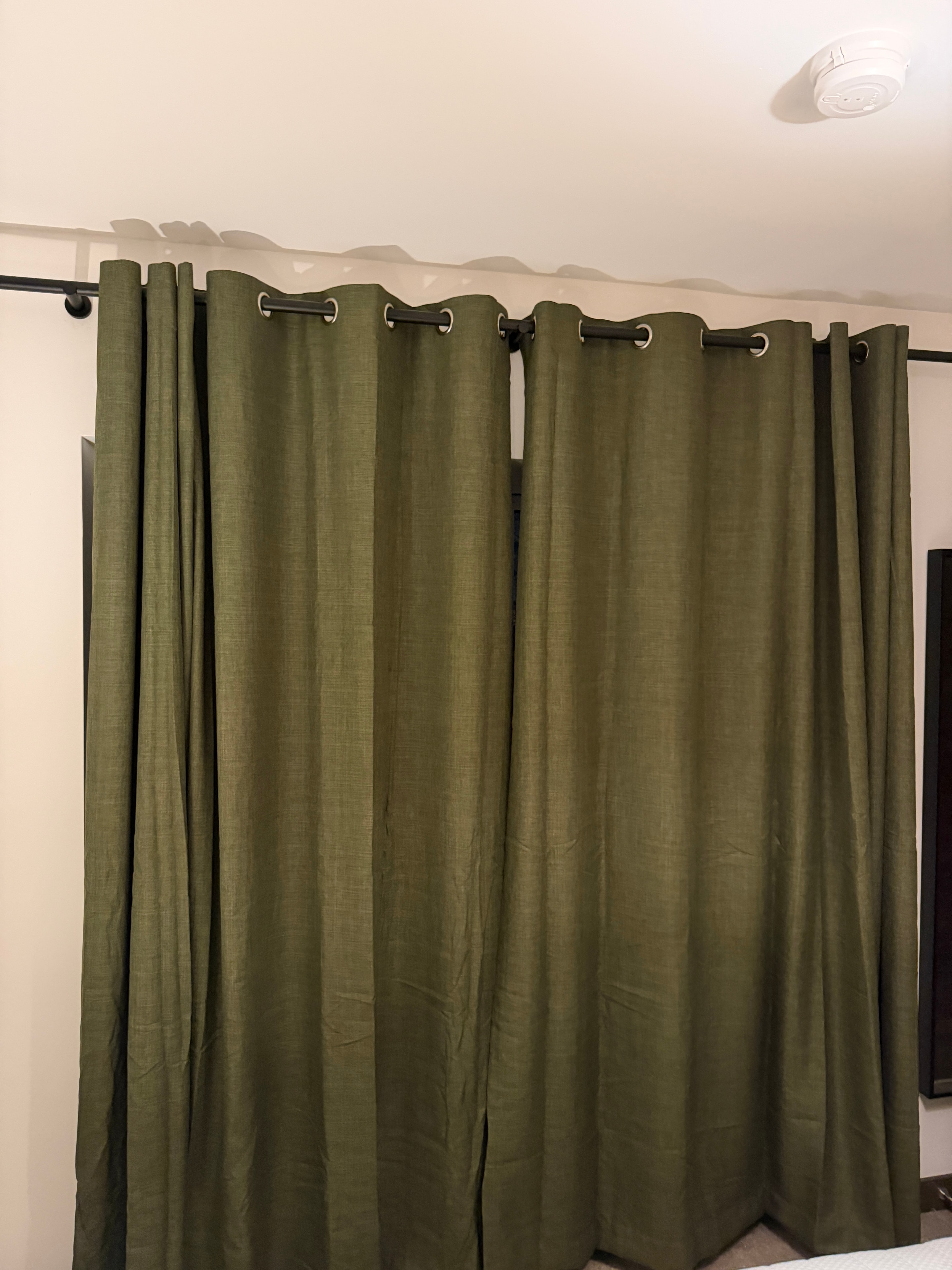 Curtain pole fitted and level above window