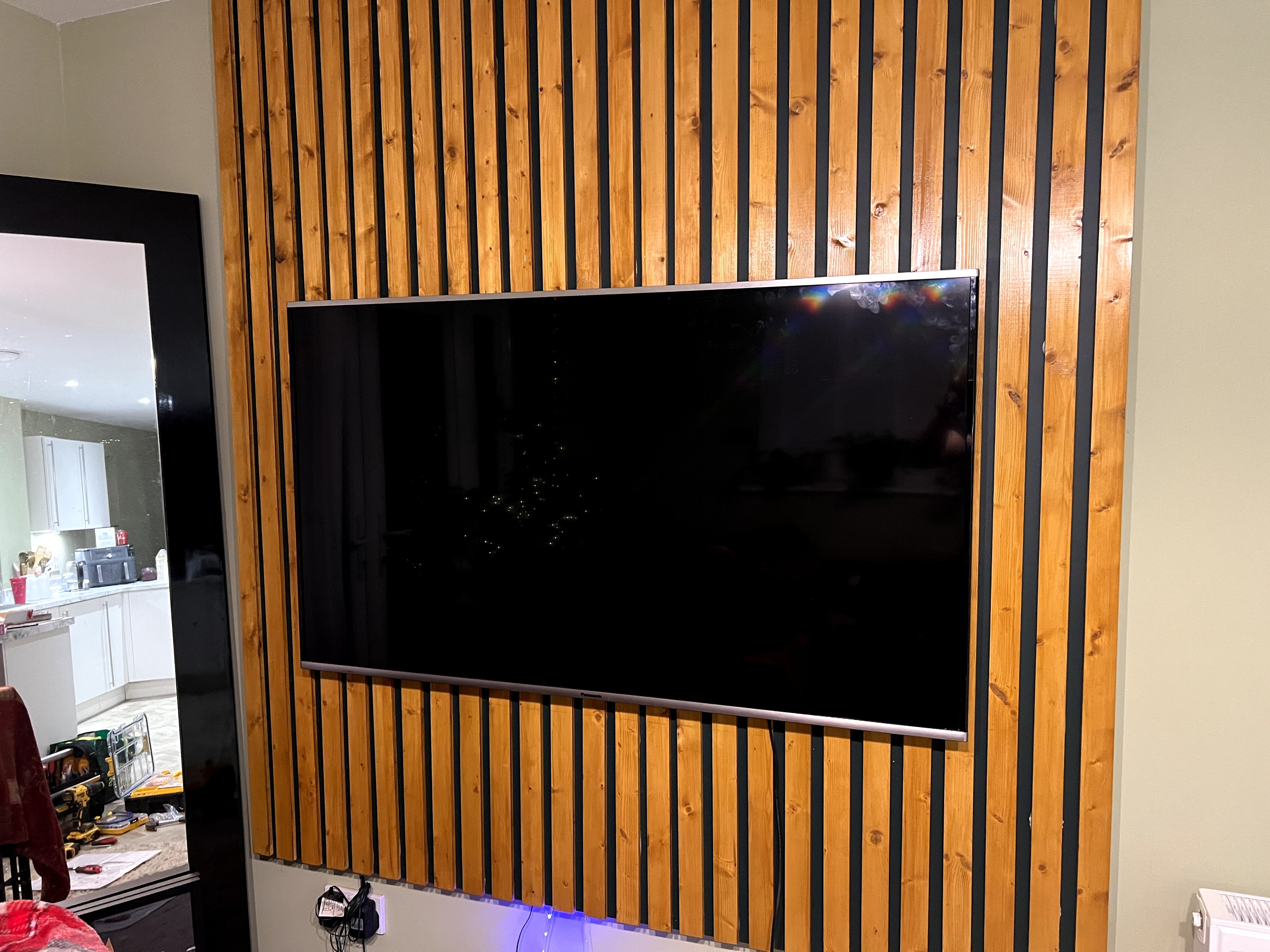 TV wall mounted on feature wall