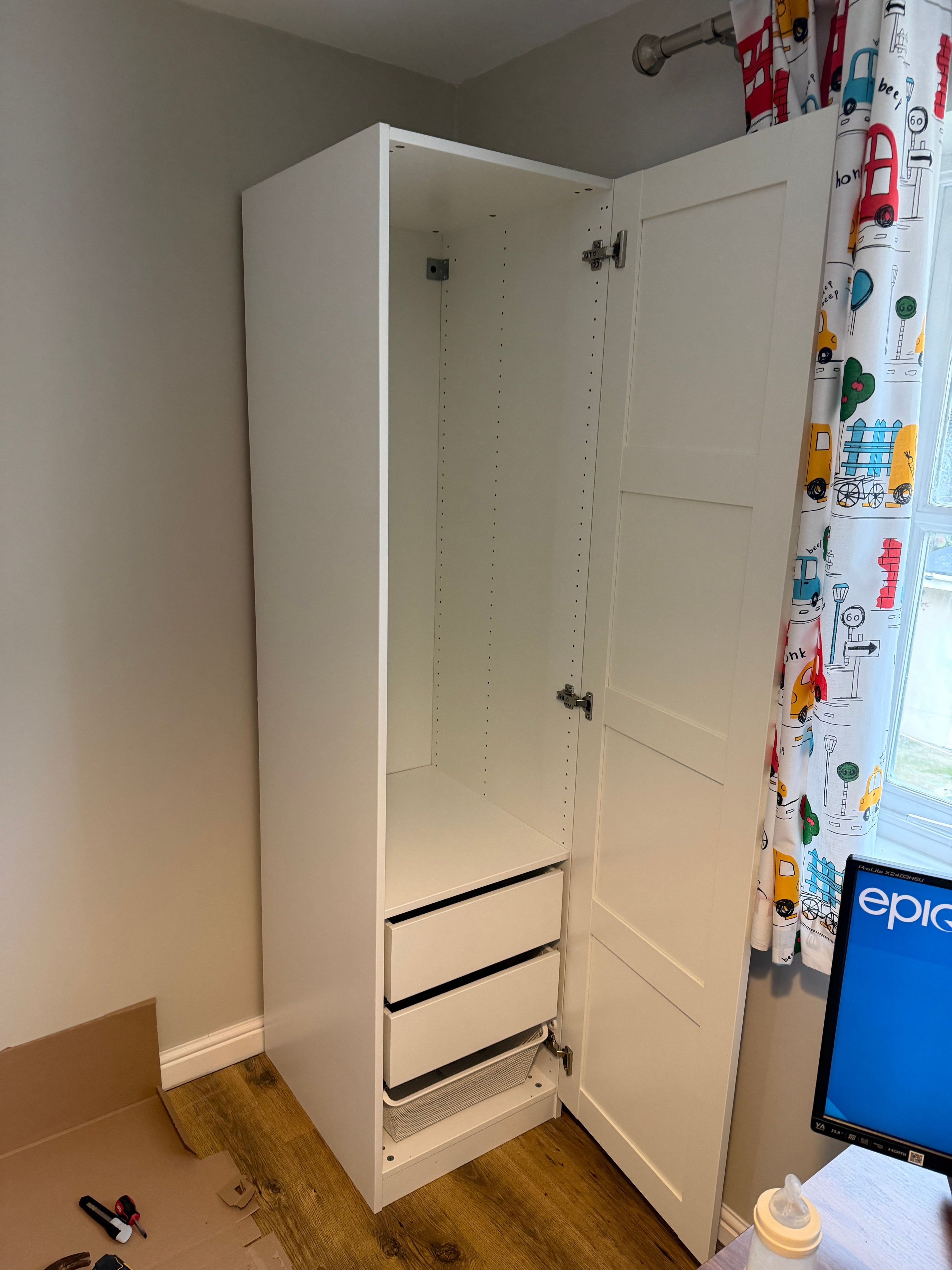 White storage chest bench with lift-up lid assembled in children's room